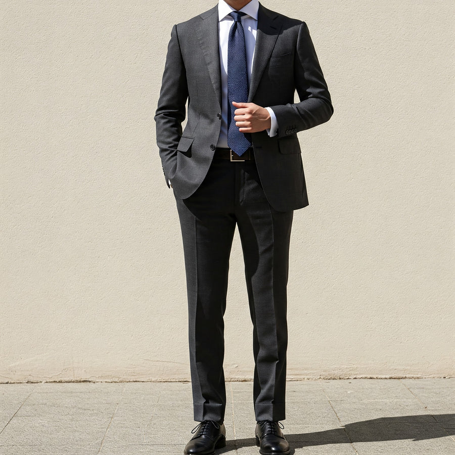 men’s charcoal grey suit with white shirt and blue tie formal business outfit
