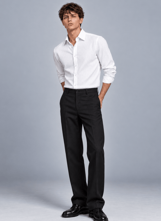 Man wearing a white micro basket weave dress shirt with black tailored trousers and black dress shoes.