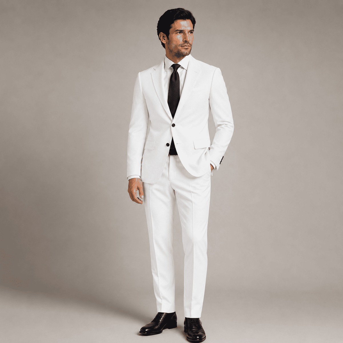 Men’s white linen bespoke suit with a white dress shirt, black tie and black dress shoes, shown in a full-length tailored look.
